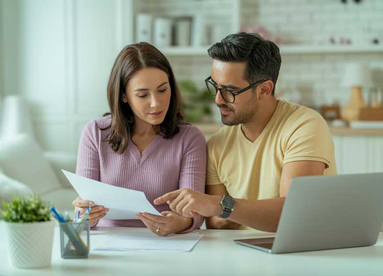 Couple reviewing AC Specs