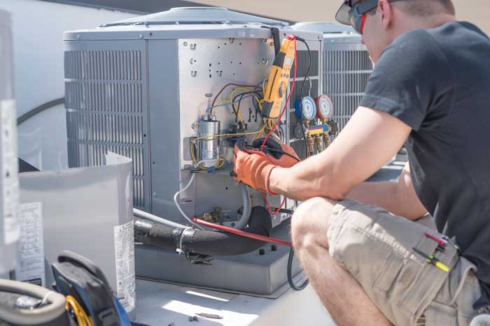 Man performing AC tune-up